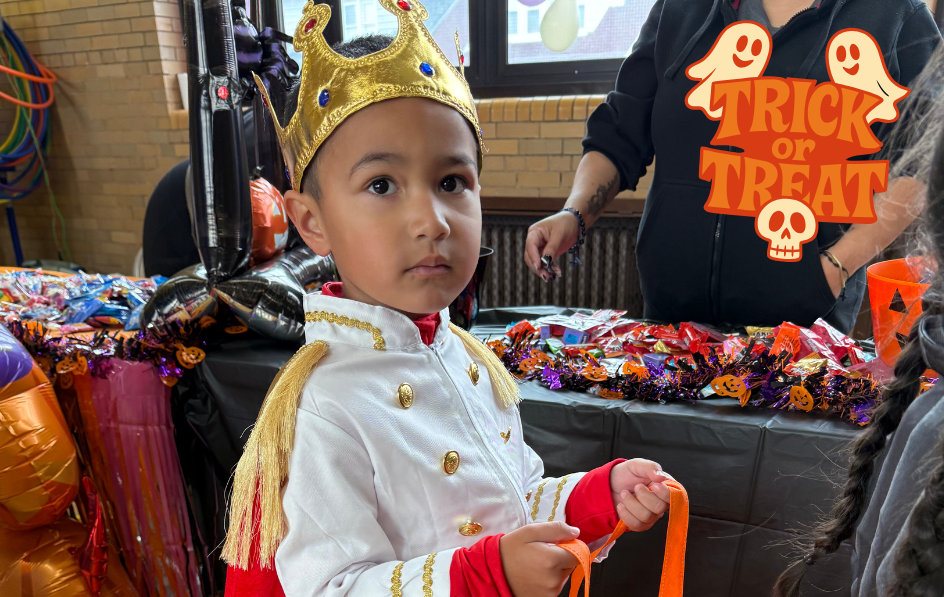  A student dressed as a prince with a candy bag 